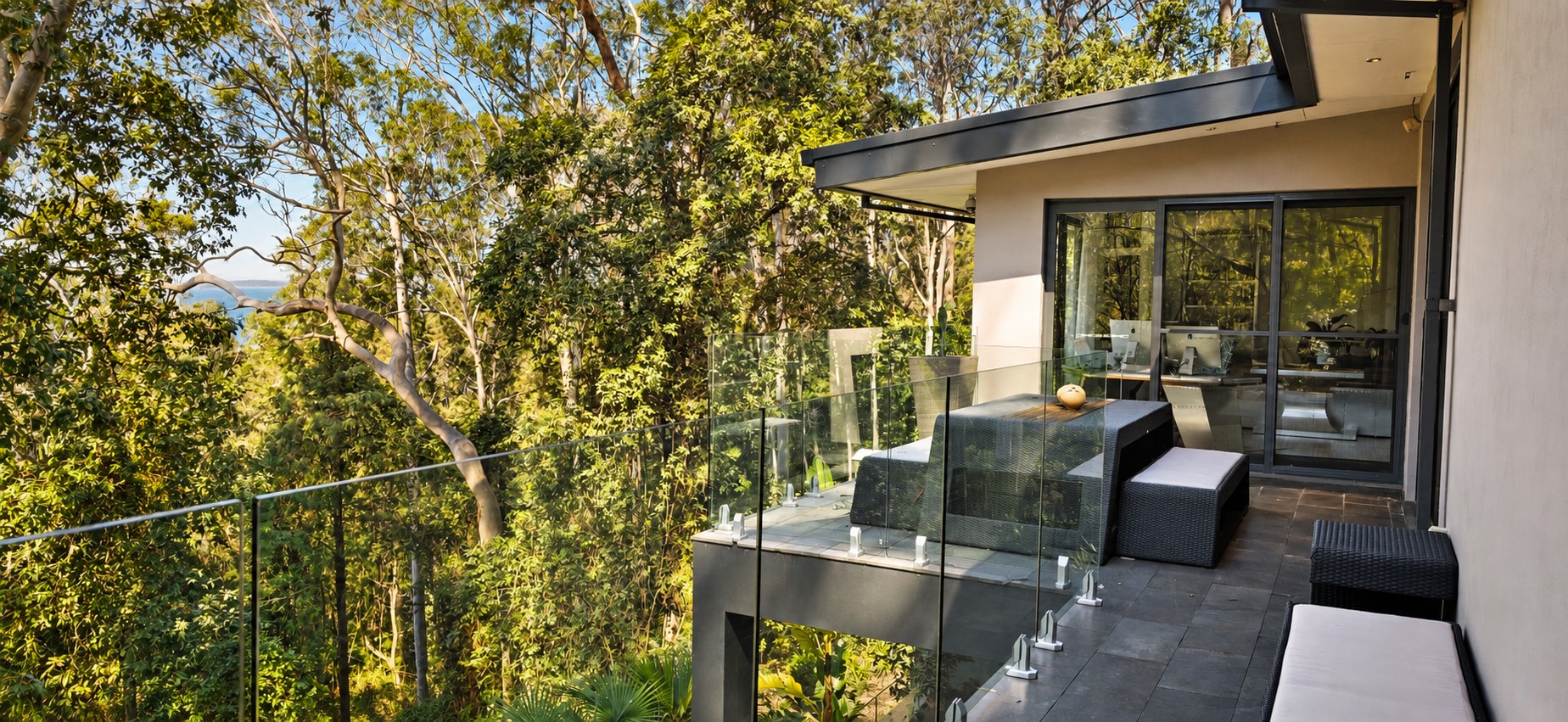 Glass-edged balcony overlooking the treetops