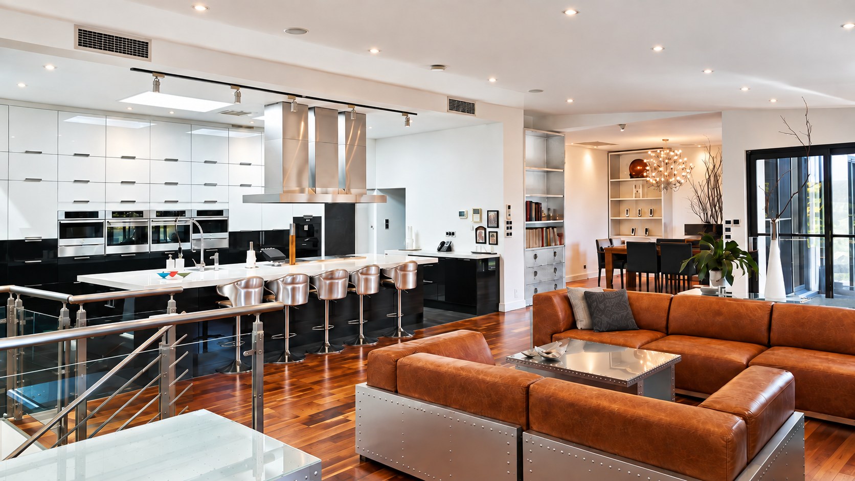 Expansive main living room and kitchen with Acacia flooring
