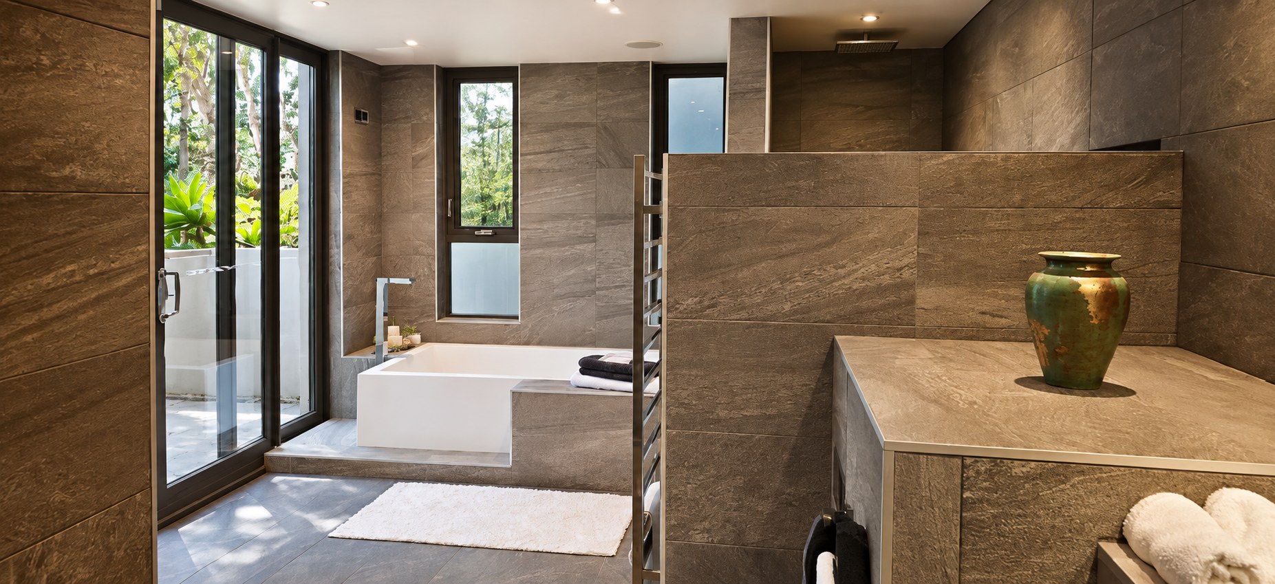 Large stone-finished principal bathroom