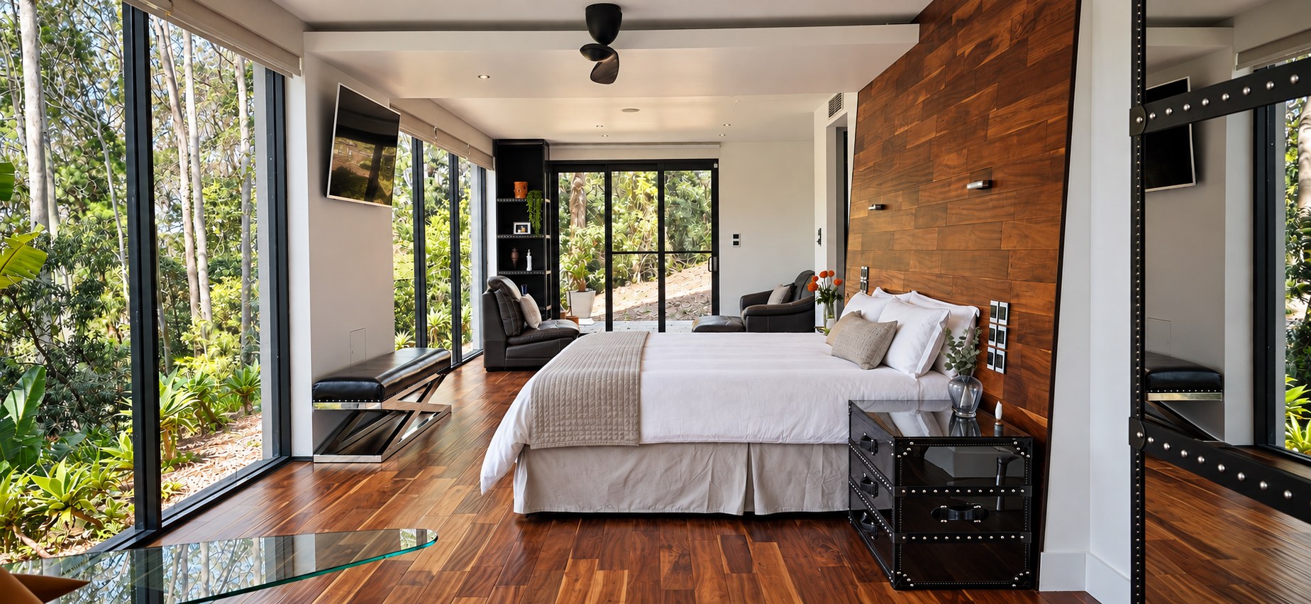 Generous principal bedroom opening to a private treetop outlook